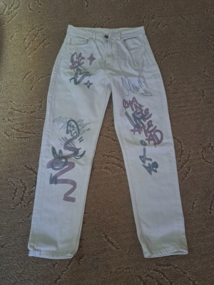 Modern girls' jeans with colorful graffiti