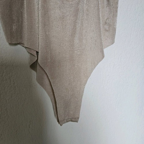Beige-gold bodysuit like new with draped neckline and laser cut detail