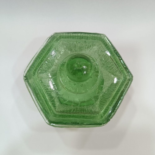 Vintage green pressed glass jewelry box with embossed lid and ridges