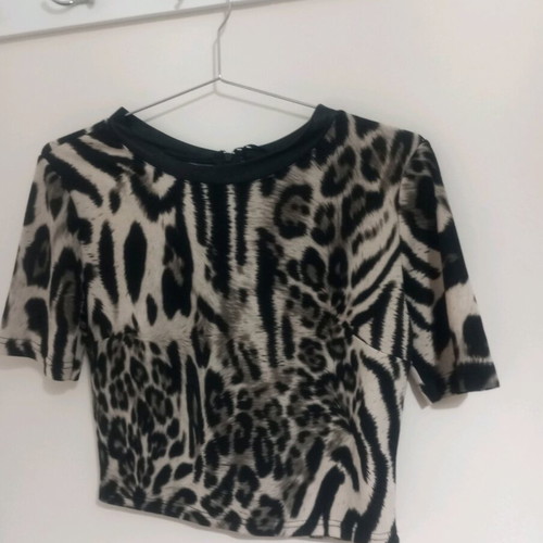 Women’s animal print top with black leather trim new, unworn