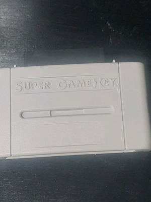 Super Game Key adapter for Super Nintendo like new, region unlock