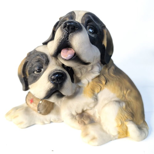 Decorative resin figurine of two puppies used