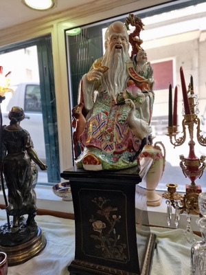 Large porcelain Buddha used, hand-painted with wooden base and jade stones