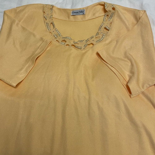 Yellow loose blouse with neckline design used