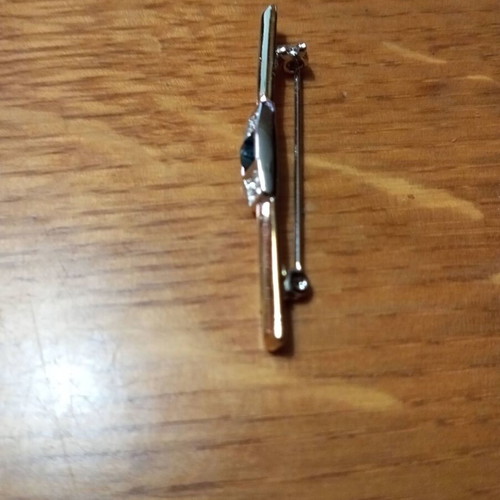 Jewelry pin like new, gold color with blue and clear stones
