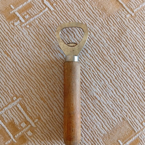 Classic bottle opener with wooden handle used