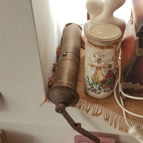 Old traditional brass manual coffee grinder used