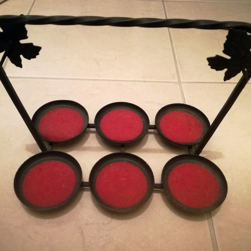 Metal candle holder for six tealights used