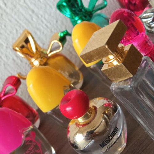 Collection of 29 empty perfume miniatures like new