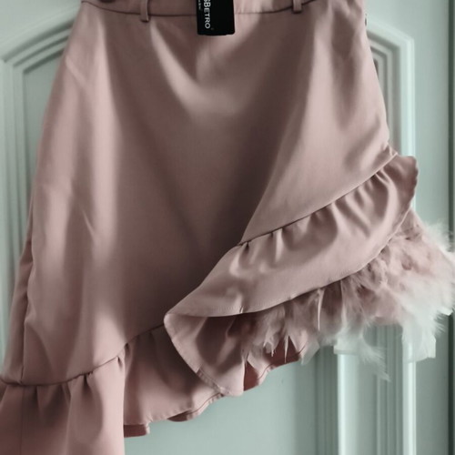 Upcycled asymmetric skirt with ruffles and pink feathers, SBETRO