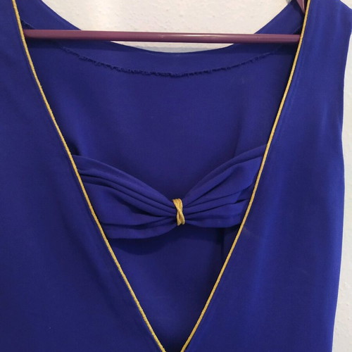 blue dress with an opening at the back