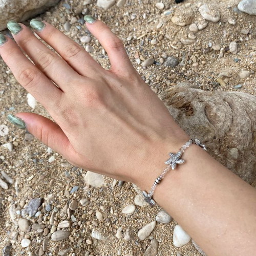 Bracelet with starfish and transparent beads, silver color