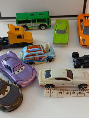 Set of 9 used toy cars including Disney Pixar models, metal and plastic