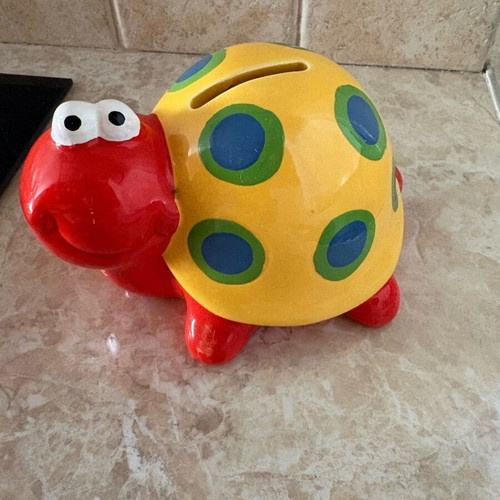 Ceramic snail piggy bank
