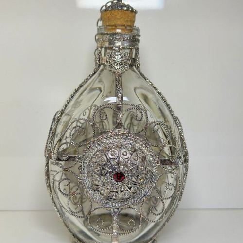 Vintage ornate handmade filigree glass bottle with red stones