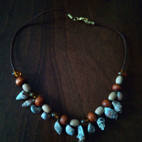 Shell and wooden bead necklace on leather strap used, summer style
