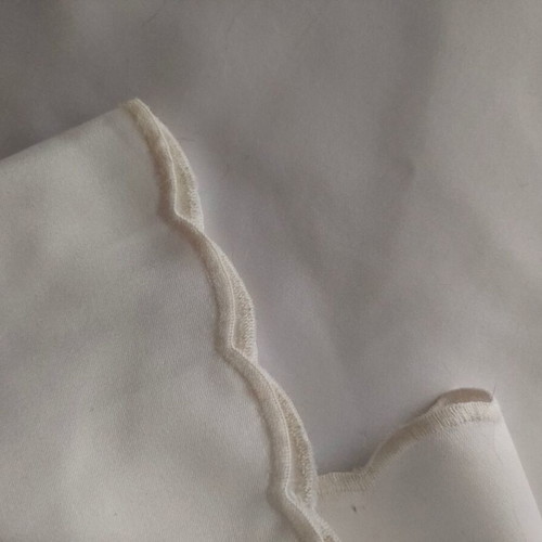 Satin round tablecloth like new, radius 1.28 m, cutwork edge