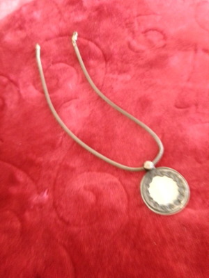 two bracelets, one silver and the other stone with a leather binding