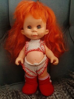 Doll used with comic face and thick hair