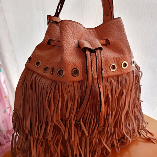 Pink shoulder bag with fringes used