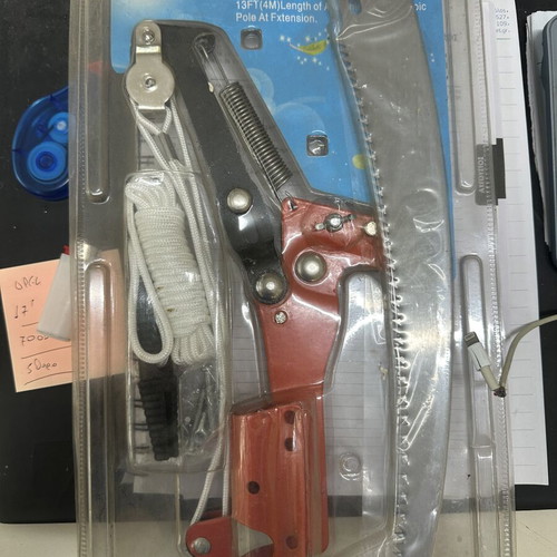 Pole pruner with pulley system and saw attachment