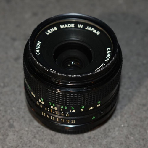 Canon A-1 collectible pack like new with Motor Drive, strap and 35mm f/2.8, 135mm lenses