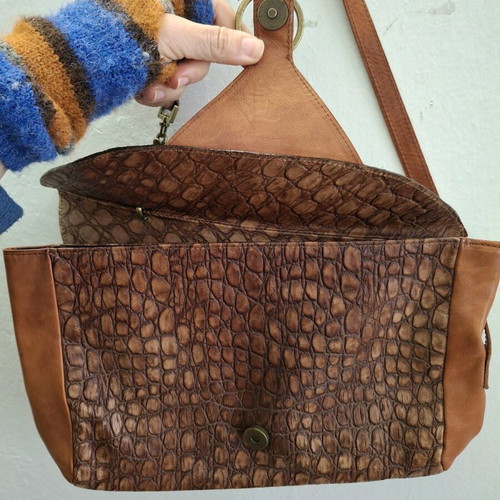 Vintage cowboy leather shoulder bag with metal accents like new
