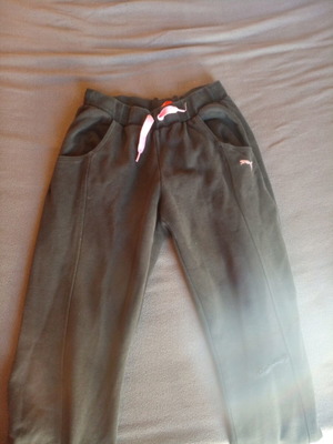 Puma sportswear used, size M, black with knee repair