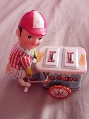 Vintage tin wind-up ice cream seller toy
