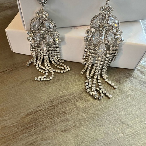 Earrings new with crystals, silver color