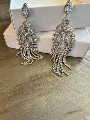 Earrings new with crystals, silver color