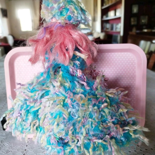Doll with handmade dress and hat used