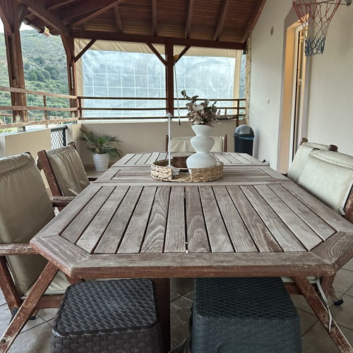 Outdoor wooden dining set used with 6 chairs and cushions