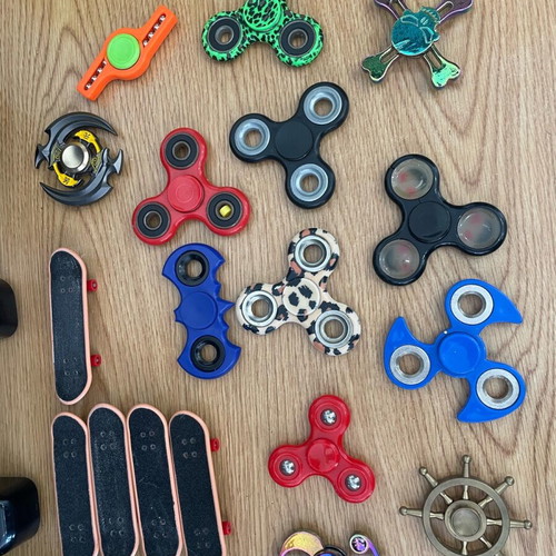 Used toys with figure spinners and skates