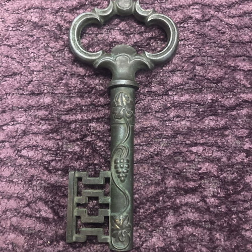 Vintage bottle opener used with patina, brass and steel
