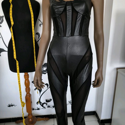 One-piece black jumpsuit with sheer panels and elastic leather, new XS