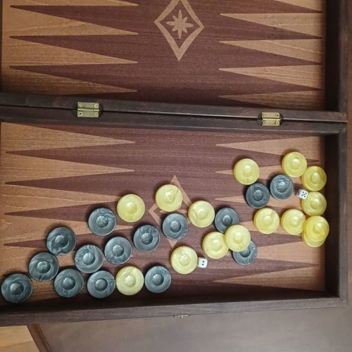 Wooden backgammon new with its pieces