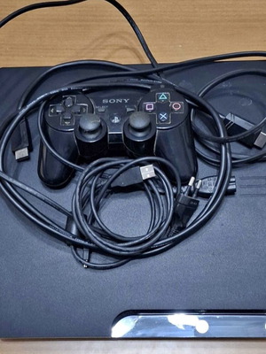 PlayStation 3 Slim console like new with 3 controllers and cables