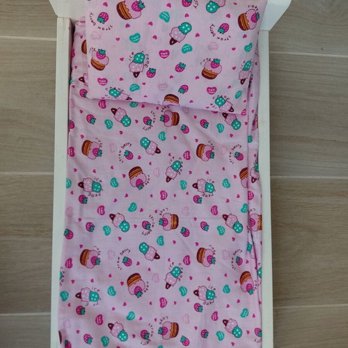 Doll bed with handmade bedding and doll used