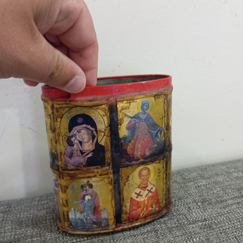 Vintage metal pencil holder decorated with icons used