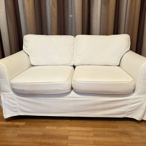 Two-seater sofa with white fabric cover like new