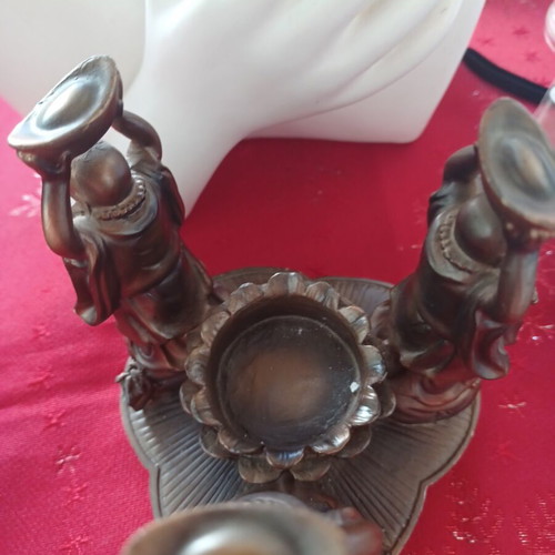 Asian candlestick with 3 smiling figures used, bronze finish