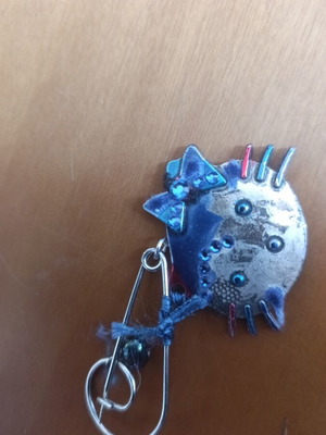 Metal pin with safety pin used, blue and silver with rhinestones