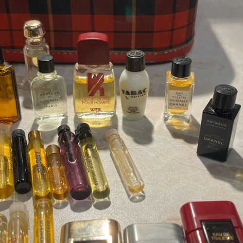 Filled vintage women's perfume vials from 1960-1990