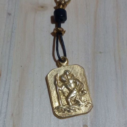Saint Christopher keychain used, metallic gold color