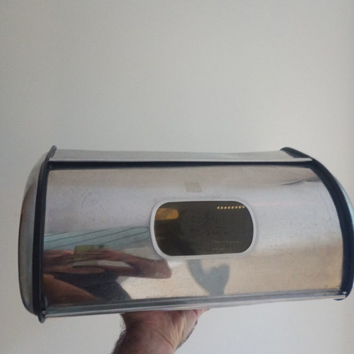 Metal bread box with two dents