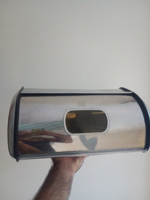 Metal bread box with two dents