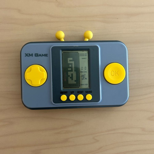 Vintage XM Game handheld console with multiple games