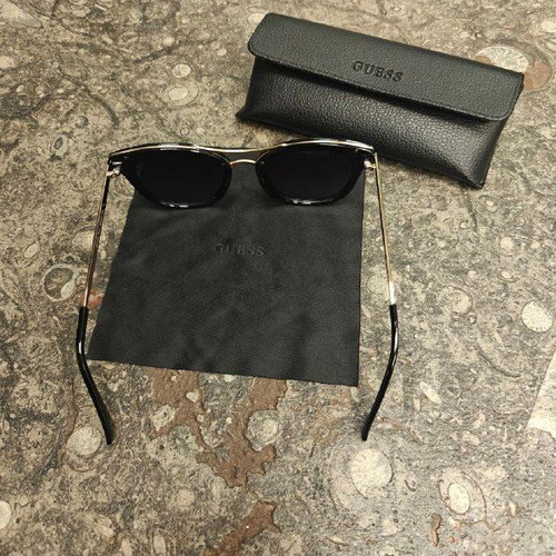 Guess women's sunglasses with black protective case and cloth