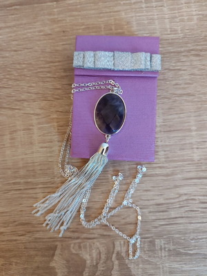 Avon necklace with faux amethyst stone and silver tassel
